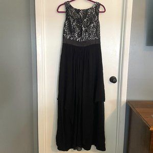 Black tie. Floor length dress.